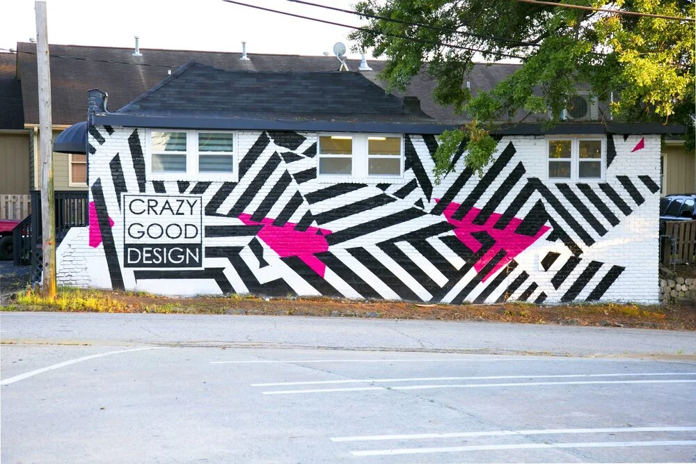 Hand-painted mural on a building in Atlanta, GA. Urban street art style.