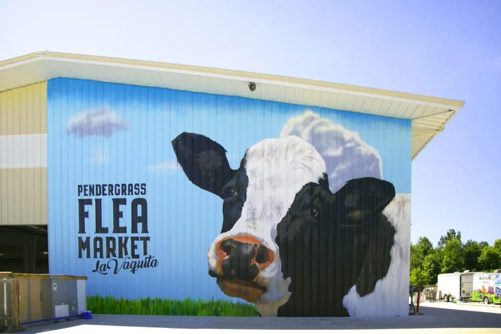 Hand-painted mural in Atlanta, GA. Farm animal scene with cows.