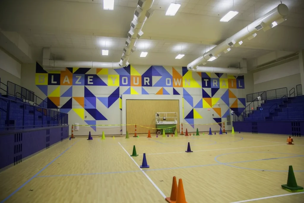 Hand-painted mural in Atlanta, GA. Colorful geometric patterns.