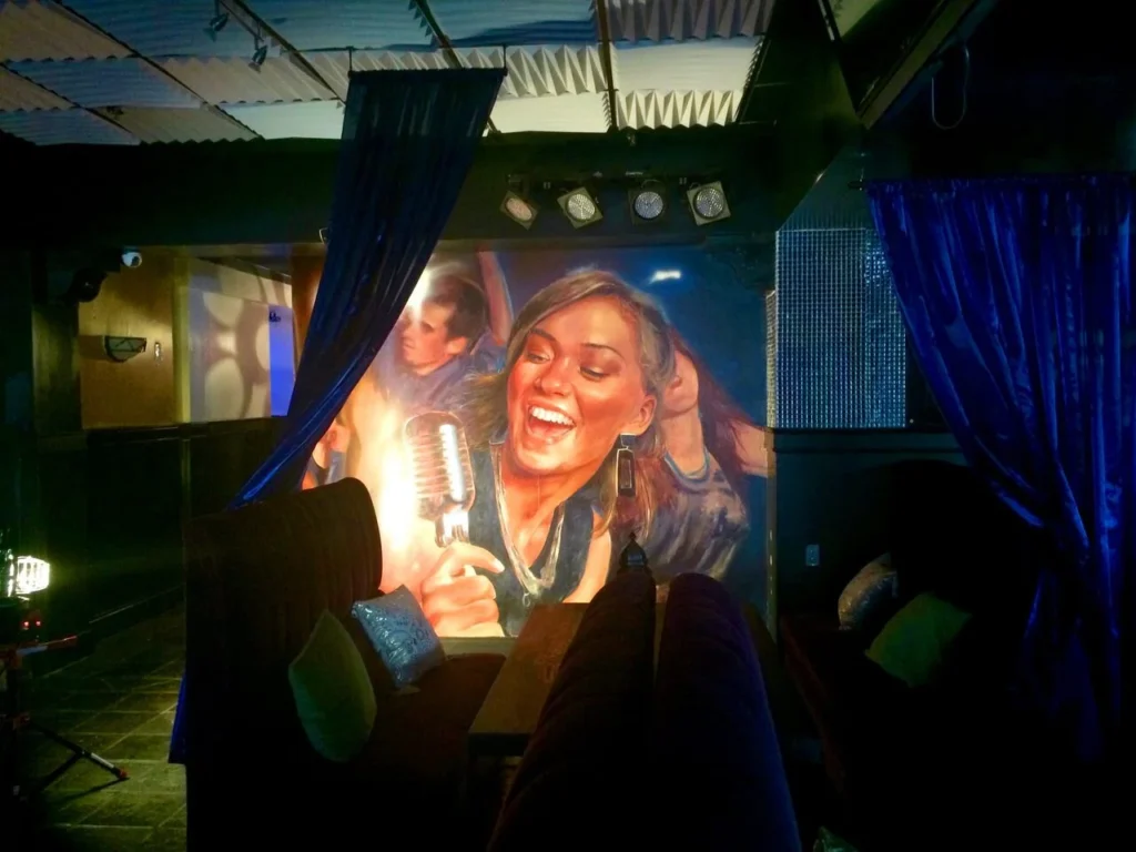 Hand-painted mural in Atlanta, GA. Realistic portrait of a woman.